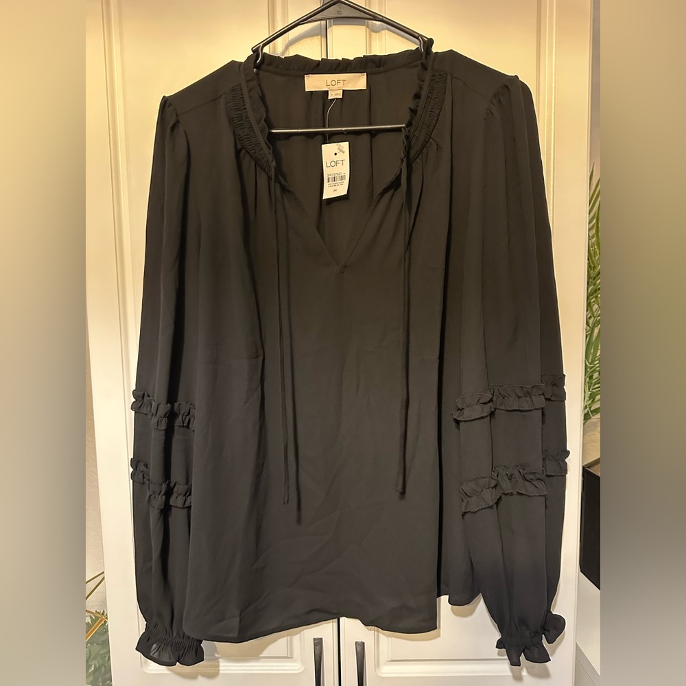 Woman’s black blouse